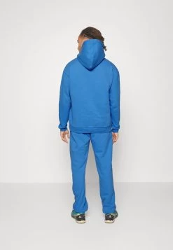 Pinqponq UNISEX - Jogginghose - Cornflower Blue -Frauen Geschäft 1dc880535b3249a4a79623cd44d98db9